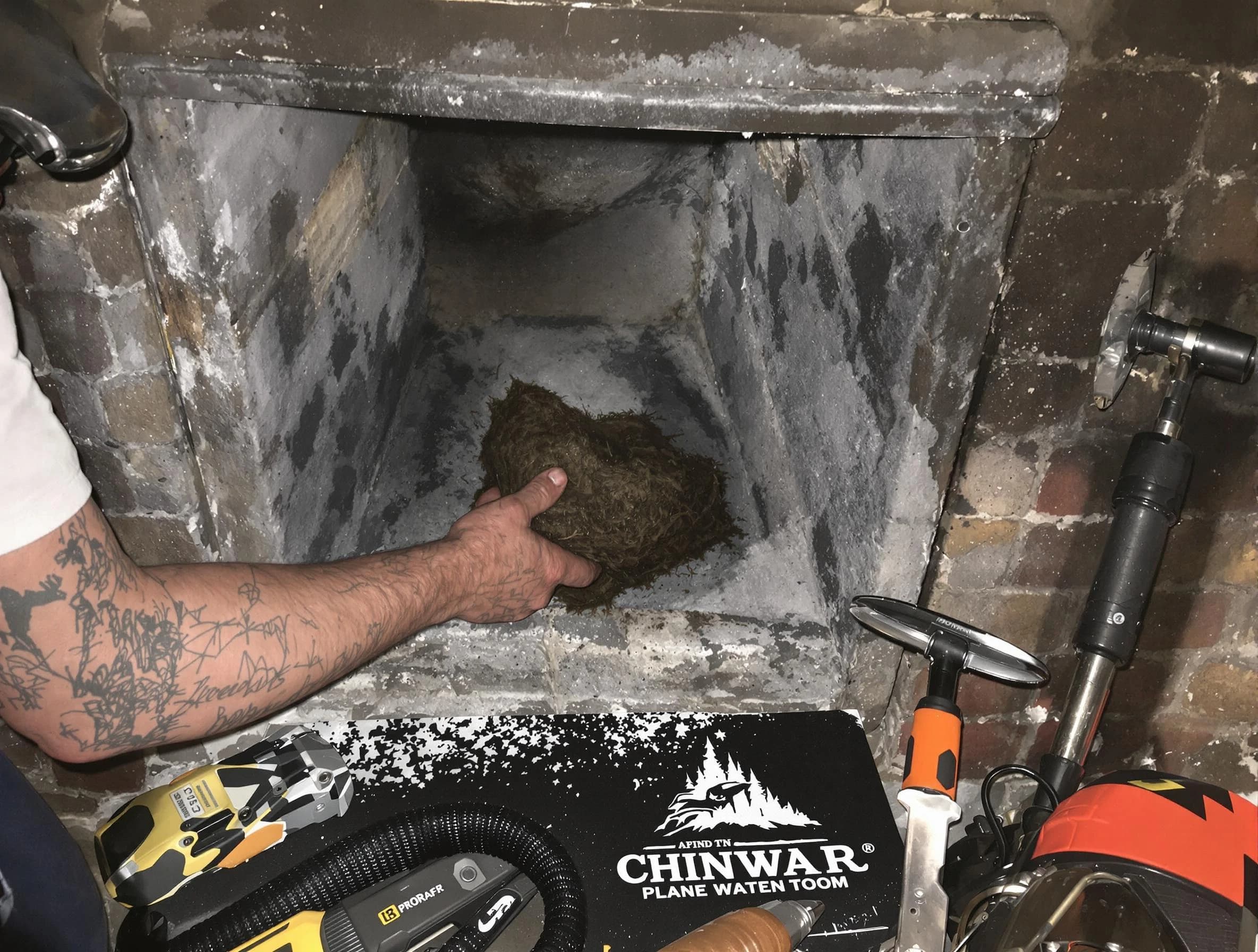 Plain City Chimney Sweep safely removing debris and screening chimney in Plain City, UT